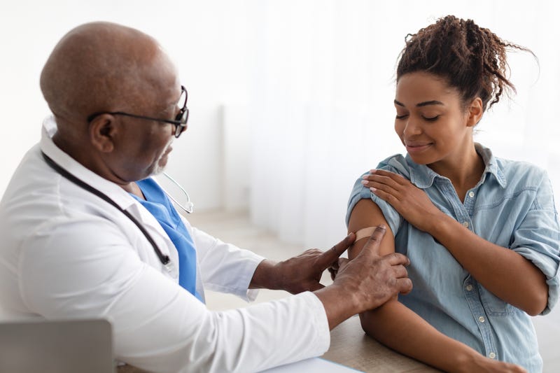 Woman getting her COVID-19 booster vaccine. 