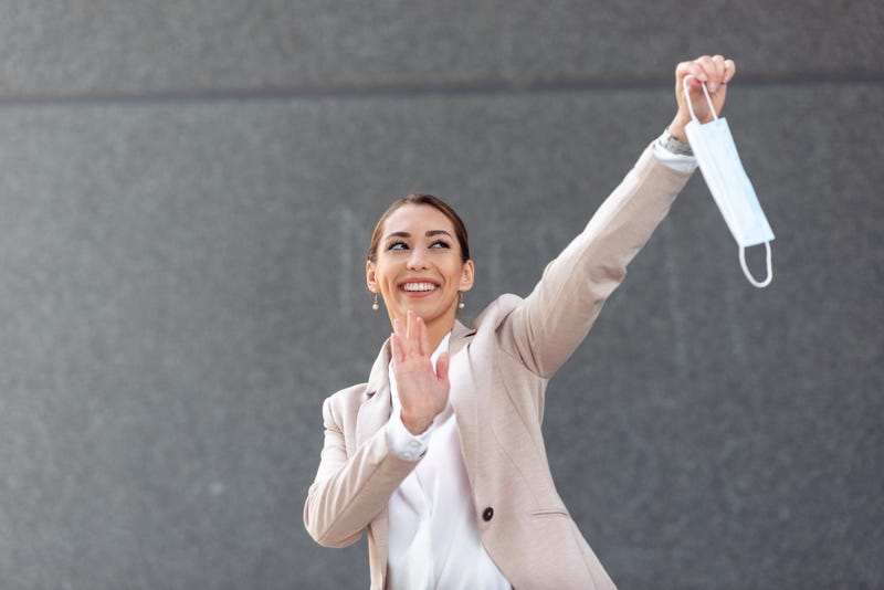 Person waiving at a mask.
