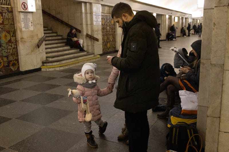 People shelter in a subway station before a curfew comes into effect on February 24, 2022 in Kyiv, Ukraine. Overnight, Russia began a large-scale attack on Ukraine, with explosions reported in multiple cities and far outside the restive eastern regions held by Russian-backed rebels.
