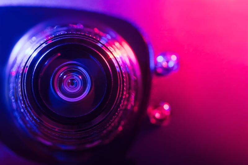 A woman's gut feeling that something wasn't right after seeing a skewed ceiling tile proved correct after she discovered a camera in the bathroom.