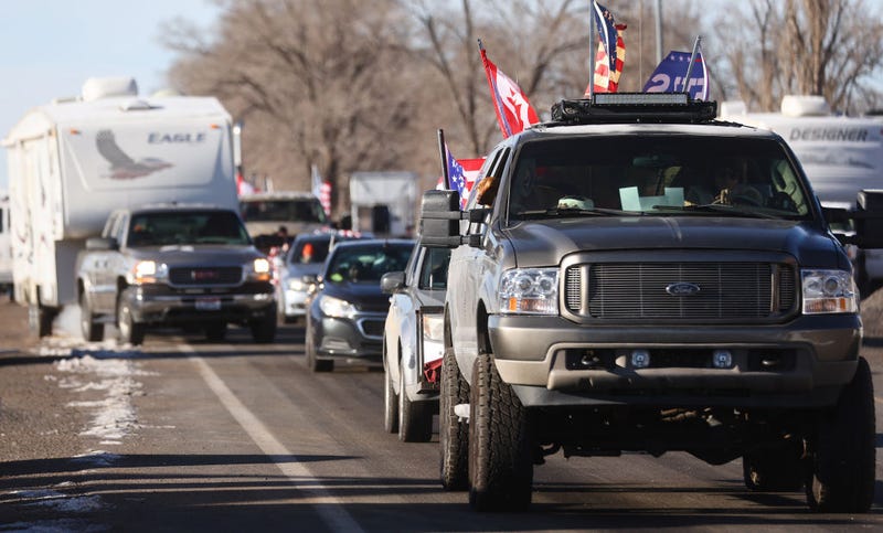 Supporters depart for the day in the ‘People’s Convoy' of truckers and supporters on their way to Washington, DC to protest COVID-19 mandates on February 25, 2022 in Lupton, Arizona. The protestors are calling for a full re-opening of the country and are scheduled to arrive in Washington, DC, on March 5. (Photo by Mario Tama/Getty Images)