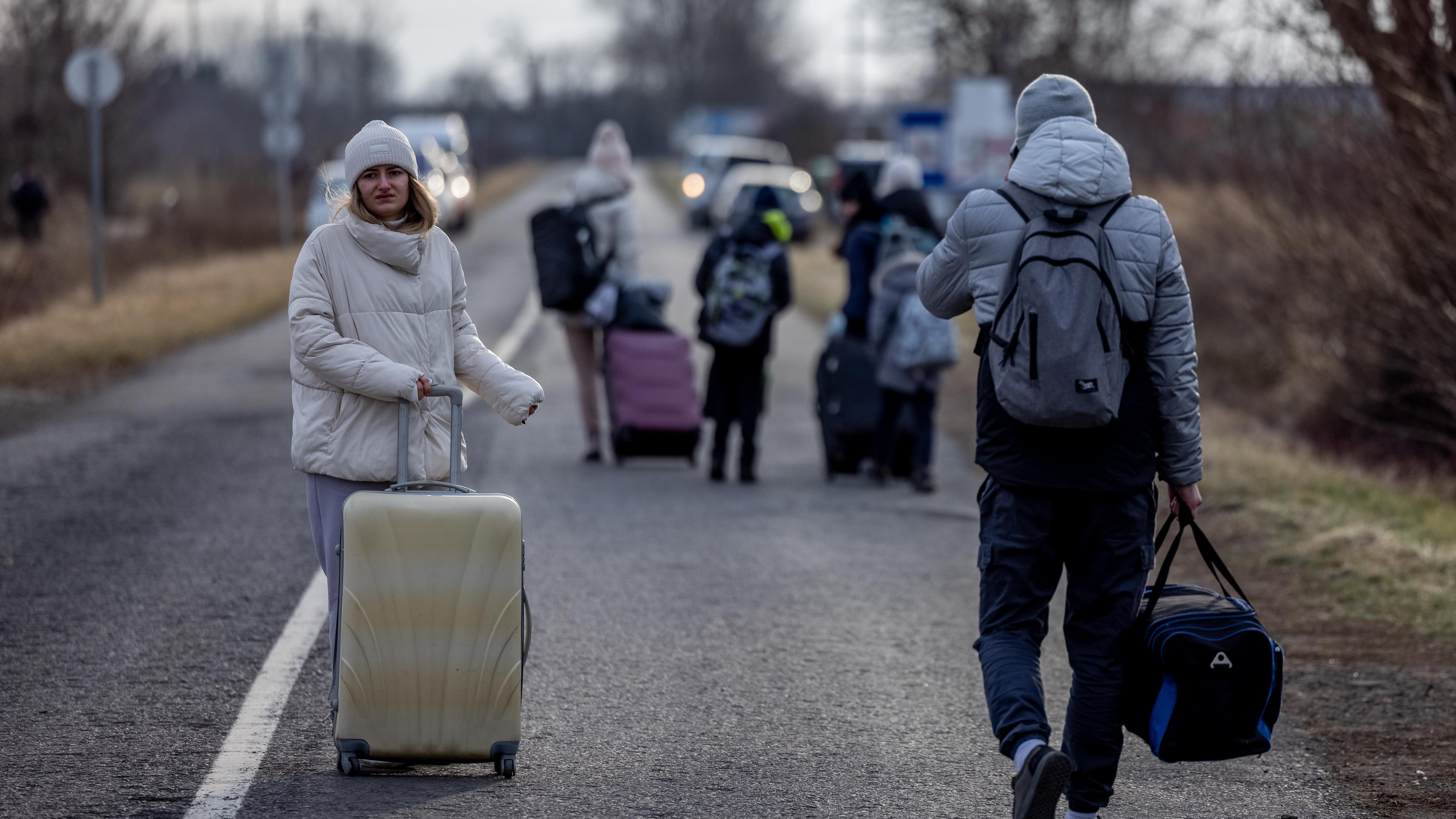 People in Ukraine flee to bordering countries for safety from Russian troops