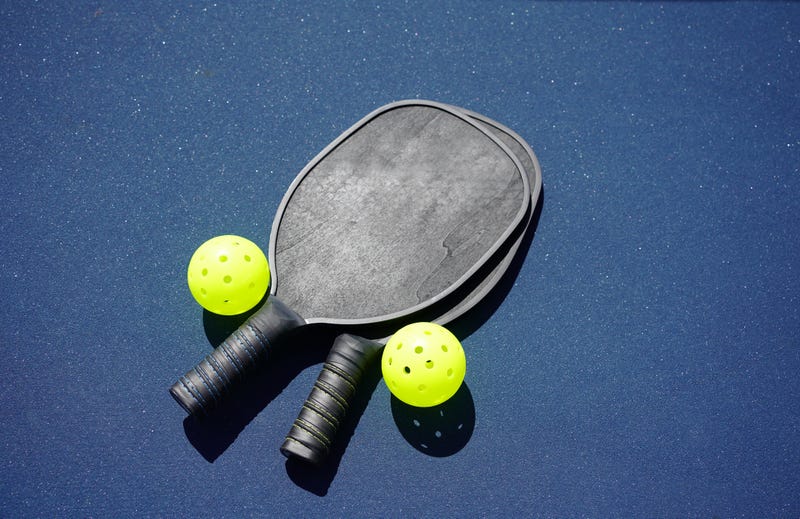 Pickleball rackets and balls. 
