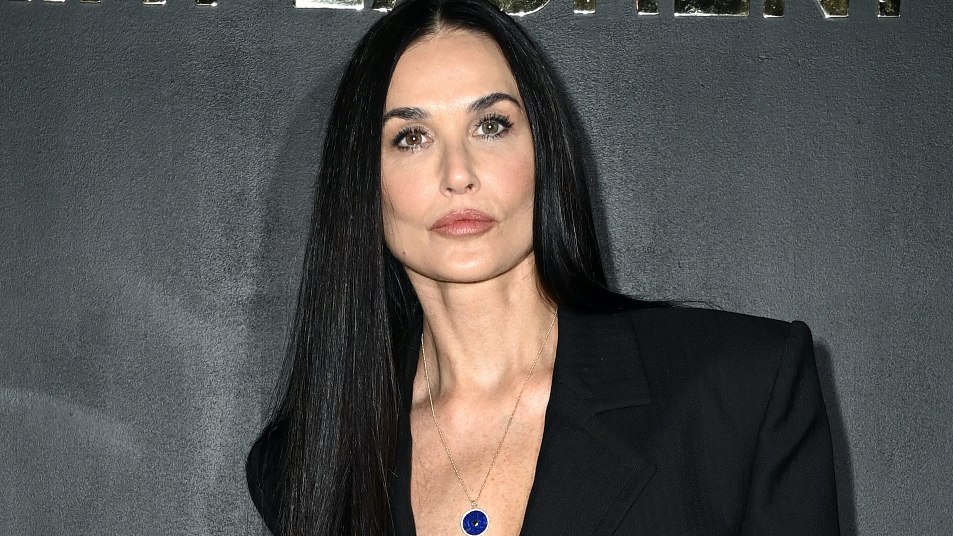 Demi Moore, 59, takes the plunge in revealing black outfit at Paris fashion show