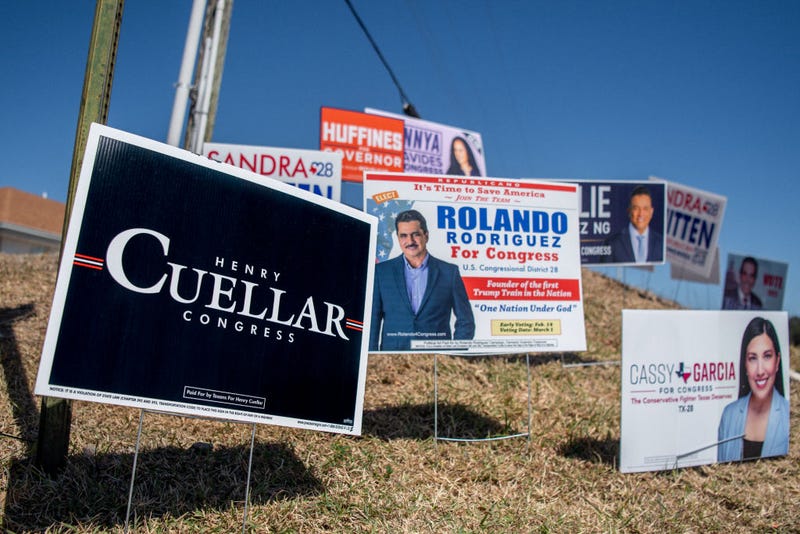 Candidate signage is seen on a hill near the Laredo Fire Department polling site on March 01, 2022 in Laredo, Texas. Texans were headed to the polls to vote in the state's first primary of the 2022 midterm elections at the time. (Photo by Brandon Bell/Getty Images)