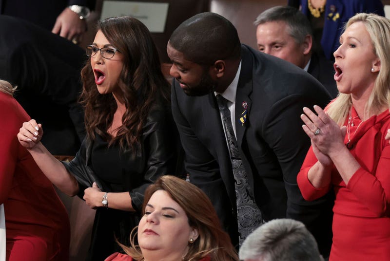Rep. Lauren Boebert (R-CO), Rep. Byron Donalds (R-FL) and Rep. Marjorie Taylor Greene (R-GA) chant "build the wall" as they listen to U.S. President Joe Biden's State of the Union address in the U.S. Capitol's House Chamber March 01, 2022 in Washington, DC. (Photo by Win McNamee/Getty Images)