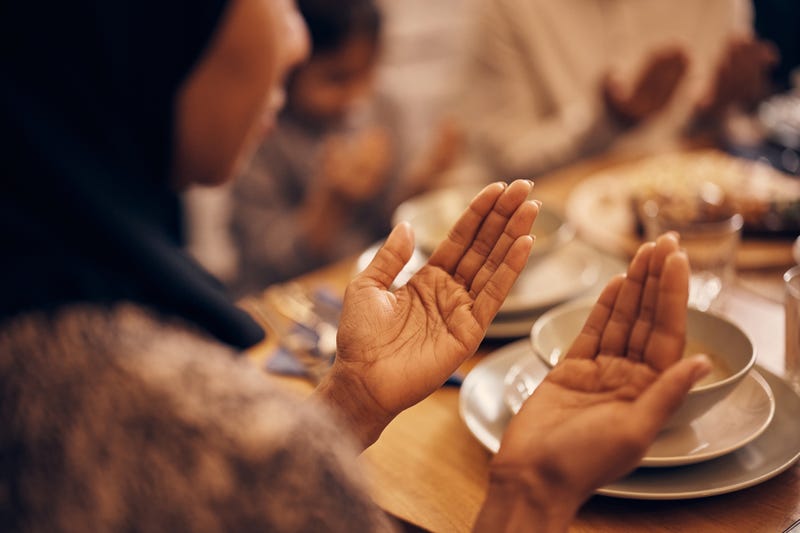 Stock image of Muslim woman praying before Suhoor