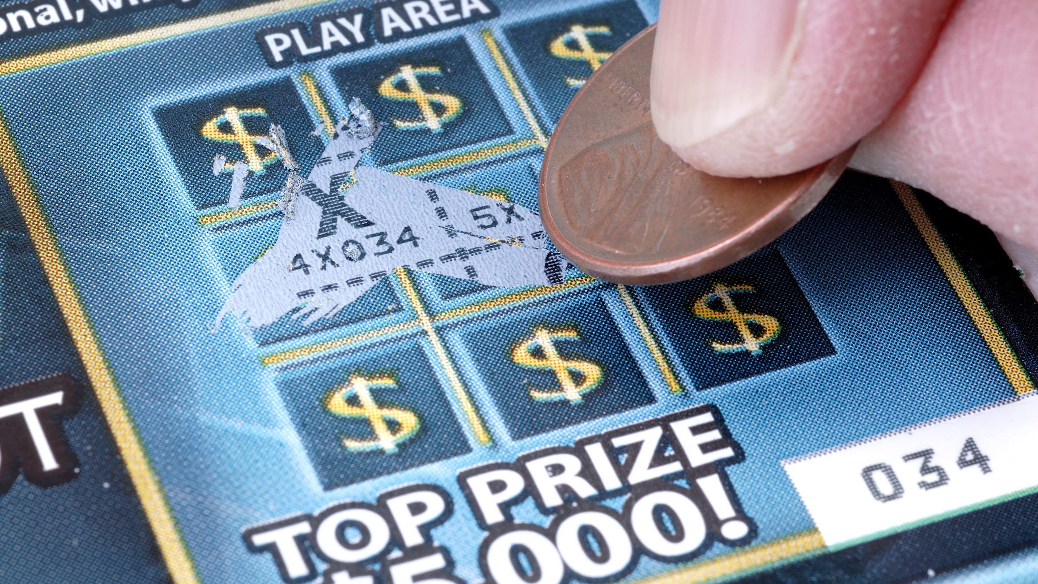 Woman wins $10 million lottery prize after pushing the wrong button