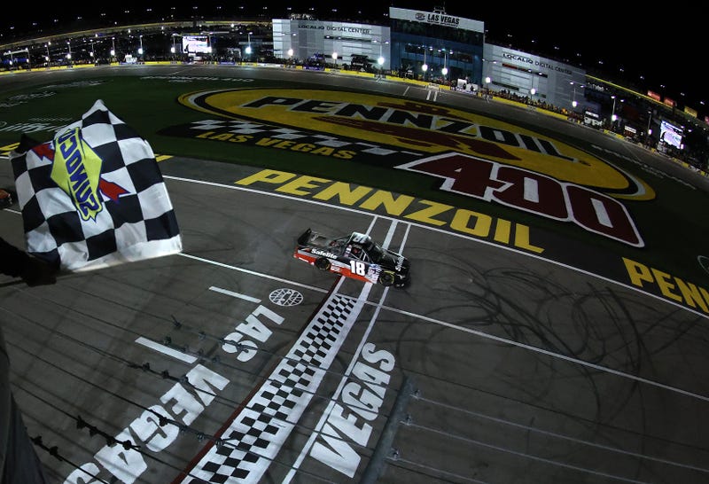 Chandler Smith, driver of the #18 Safelite AutoGlass Toyota, takes the checkered flag to win the NASCAR Camping World Truck Series Victoria's Voice Foundation 200 at Las Vegas Motor Speedway on March 04, 2022