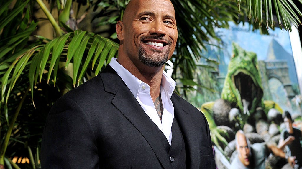 Dwayne Johnson flexes huge muscles before hitting the gym: 'That's not the rock, it's a boulder'