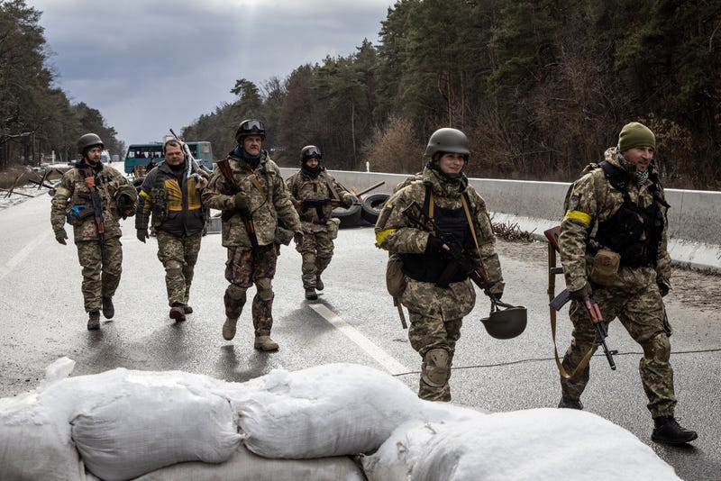 Members of the Ukrainian military arrive to reinforce a forward position on the eastern frontline near Kalynivka village on March 08, 2022, in Kyiv, Ukraine