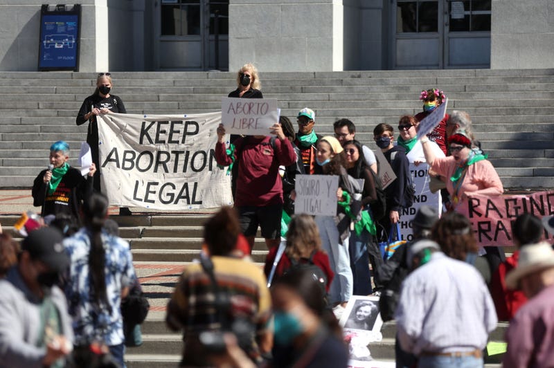 Demonstrators hold signs as they stage a protest in favor of abortion rights on the steps of Sproul Hall on the U.C. Berkeley campus on March 08, 2022 in Berkeley, California.