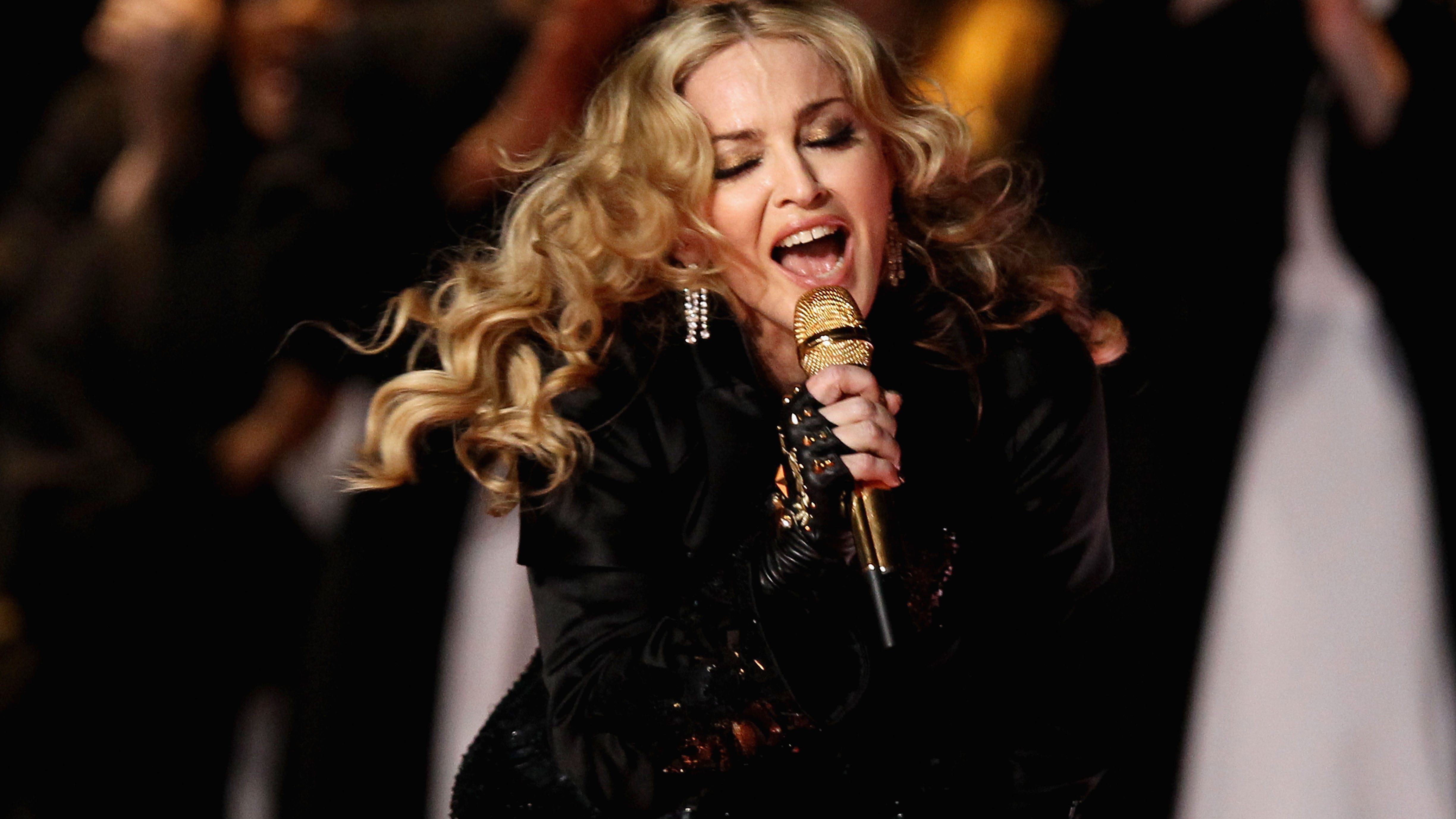 Madonna puts upcoming tour on pause after illness lands her in ICU