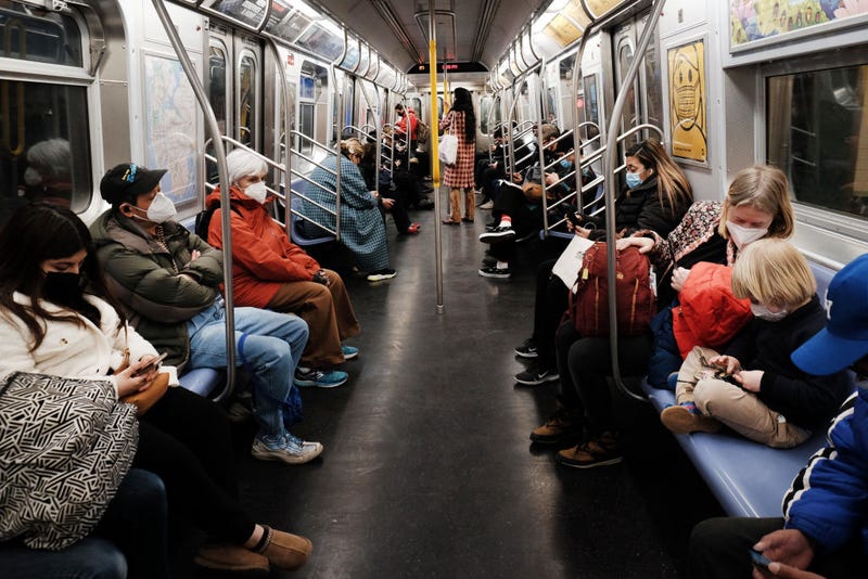 People ride on a MTA subway F train on March 11, 2022 in New York City.