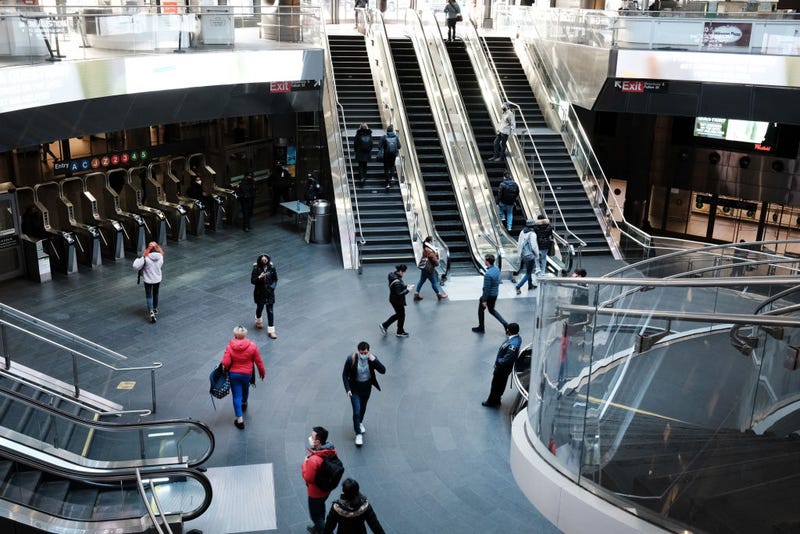 People walk through the Fulton Street subway station in lower Manhattan on March 11, 2022 in New York City.