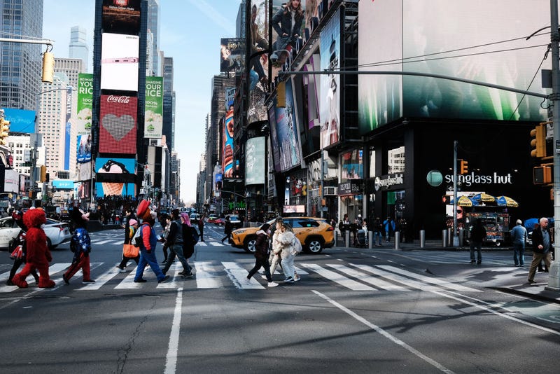 People walk through Times Square on March 11, 2022 in New York City. On the second anniversary of the pandemic.