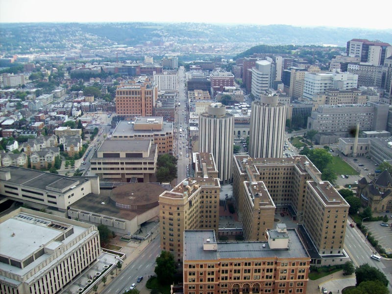 A view of Pitt University photograph taken from the Cathedral of Learning looking down on the William Pitt Union Richmond Towers law and finance building and other buildings