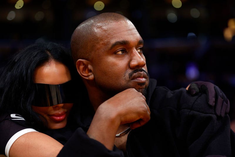 Rapper Kanye West and girlfriend Chaney Jones attend a game between the Washington Wizards and the Los Angeles Lakers in the fourth quarter at Crypto.com Arena on March 11, 2022 in Los Angeles, California. 
