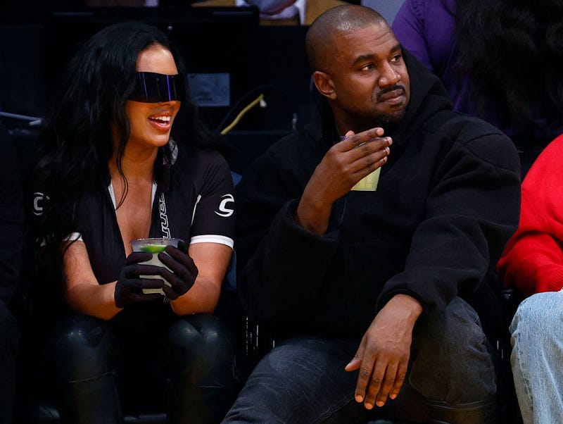 Rapper Kanye West and girlfriend Chaney Jones attend a game between the Washington Wizards and the Los Angeles Lakers in the fourth quarter at Crypto.com Arena on March 11, 2022 in Los Angeles, California. NOTE TO USER: User expressly acknowledges and agrees that, by downloading and/or using this Photograph, user is consenting to the terms and conditions of the Getty Images License Agreement. (Photo by Ronald Martinez/Getty Images)