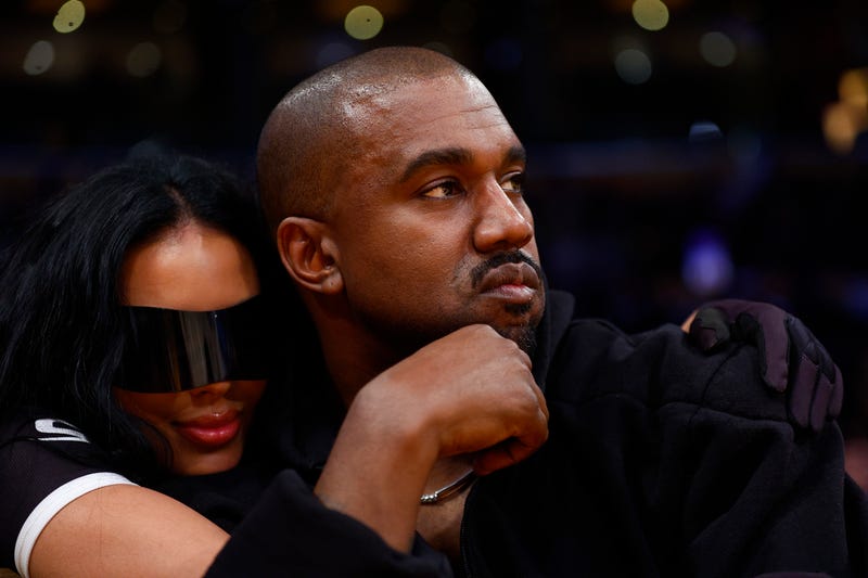 LOS ANGELES, CALIFORNIA - MARCH 11: Rapper Kanye West and girlfriend Chaney Jones attend a game between the Washington Wizards and the Los Angeles Lakers in the fourth quarter at Crypto.com Arena on March 11, 2022 in Los Angeles, California. NOTE TO USER: User expressly acknowledges and agrees that, by downloading and/or using this Photograph, user is consenting to the terms and conditions of the Getty Images License Agreement.