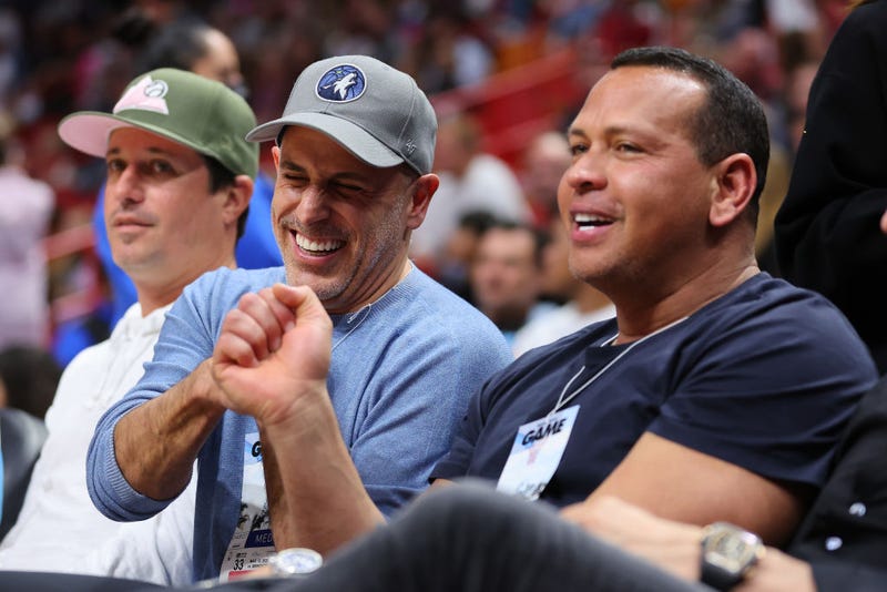 Owners Marc Lore and Alex Rodriguez of the Minnesota Timberwolves fist bump after the Minnesota Timberwolves defeated the Miami Heat at FTX Arena on March 12, 2022 in Miami, Florida. 