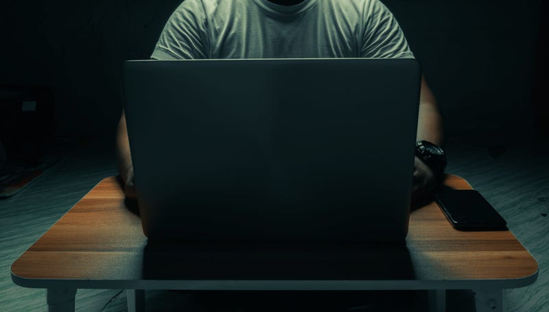 Man behind computer