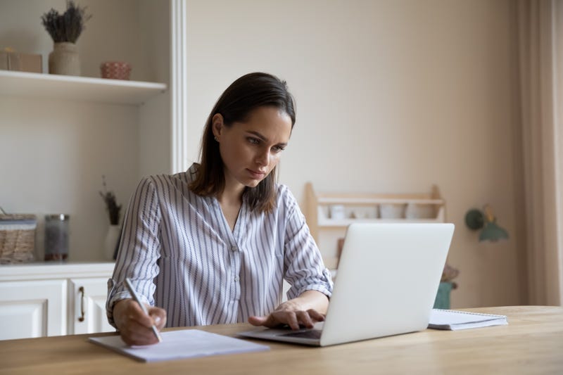 girl filling out form on computer 