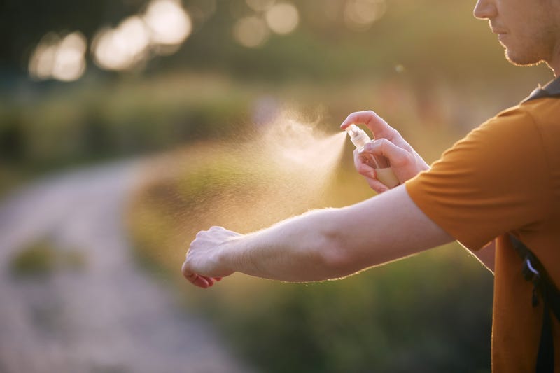 Man using bug spray
