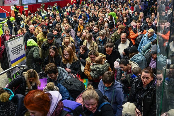 People who fled the war in Ukraine walk towards a humanitarian train to relocate refugees to Berlin on March 15, 2022 in Krakow, Poland.