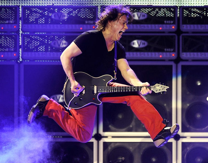 Musician Eddie Van Halen of Van Halen performs at their dress rehearsal for family and friends at the Forum on February 8, 2012 in Inglewood, California.