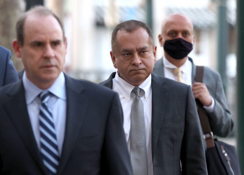 Former Theranos COO Ramesh "Sunny" Balwani (2R) arrives at the Robert F. Peckham U.S. Federal Court with his legal team on March 16, 2022 in San Jose, California.