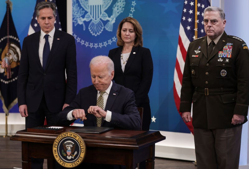 President Joe Biden signs legislative action to provide security aid and support to Ukraine as Secretary of State Antony Blinken (L), Deputy Secretary of Defense Kathleen Hicks and Chairman of the Joint Chiefs of Staff General Mark Milley look on, during an event in the South Court Auditorium at the Eisenhower Executive Office Building near the White House on March 16, 2022 in Washington, DC. President Biden delivered remarks on U.S. assistance to Ukraine as Russia's invasion of Ukraine enters its third week.