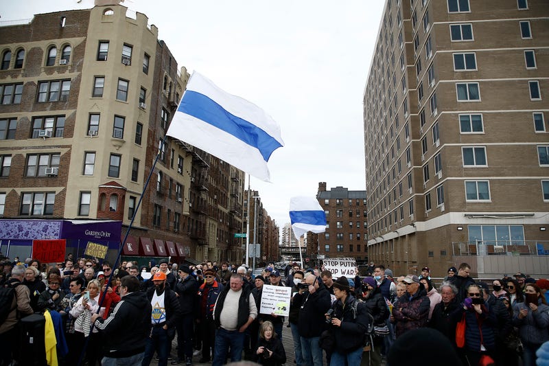 Rally participants listen to mostly Russian speakers denounce the war in the Ukraine on March 20, 2022 in the Brighton Beach section of the Brooklyn borough of New York City. As the Russian invasion of Ukraine escalates with intense shelling and targeting of civilians, many Russians have fled to neighboring countries for fear of political retribution and as a way to protest the war. 