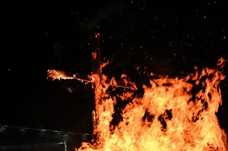 Burning cross stock photo.