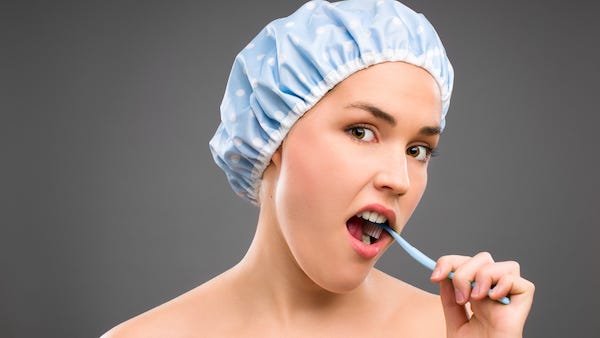 Brushing your teeth in the shower could lead to swallowing germs "you wouldn't want anywhere near your mouth"