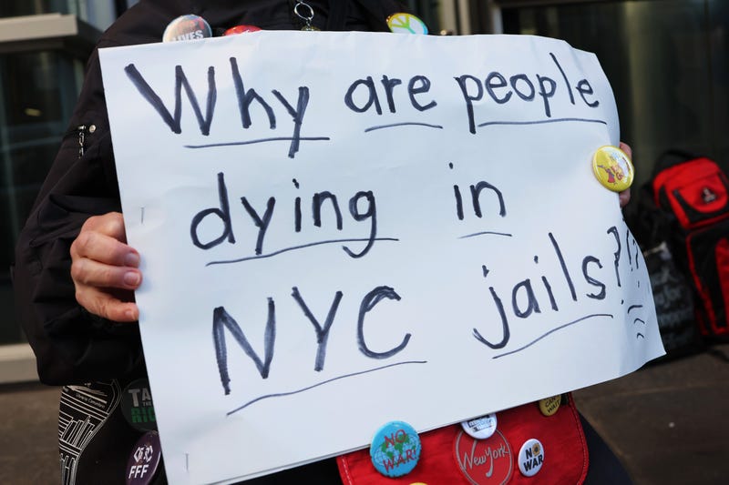 A person holds a sign during a rally outside the NYC office of Gov. Kathy Hochul on March 21, 2022 in New York City. Prison activists gathered outside of the NYC office of Gov. Kathy Hochul to bring attention to the conditions at Rikers Island following the death of a detainee on Friday while in custody in the jail. The death was the second last week and the third death at the jail complex so far this year. The activists called on Gov. Hochul to close the jail and invest in alternative options to incarceration.