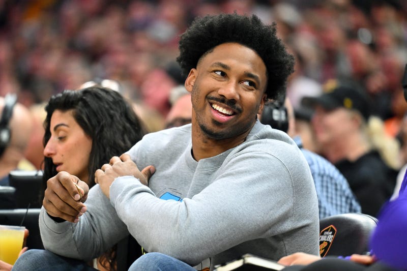 Cleveland Browns defensive end Myles Garrett talks to a fan during the second quarter of the game between the Cleveland Cavaliers and the Los Angeles Lakers at Rocket Mortgage Fieldhouse on March 21, 2022 in Cleveland, Ohio