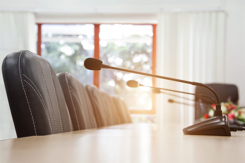 Conference microphone on conference table. Sound amplification equipment for communicating in boardrooms