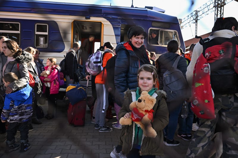 People, mainly women and children, arrive at Przemysl train station on a train from war-torn Ukraine on March 22, 2022 in Przemysl Poland
