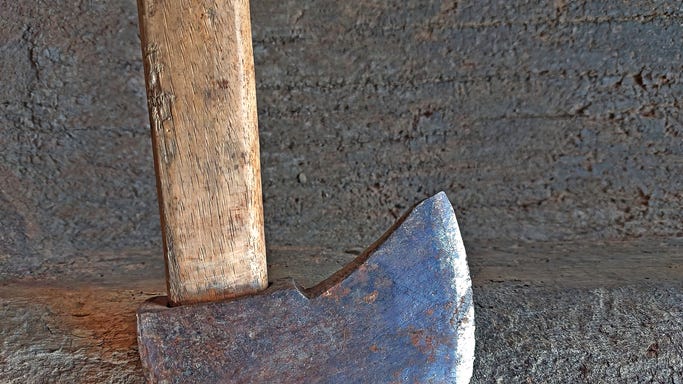 Kansas man finds mythical-looking ax with tree root handle in his yard