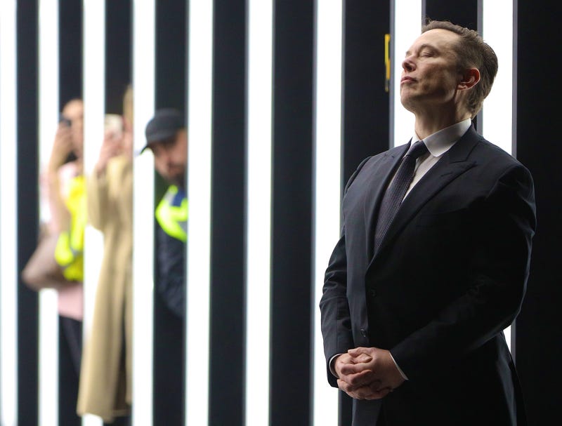 GRUENHEIDE, GERMANY - MARCH 22: (Alternate crop of #1239417601) Tesla CEO Elon Musk contemplates during the official opening of the new Tesla electric car manufacturing plant on March 22, 2022 near Gruenheide, Germany. The new plant, officially called the Gigafactory Berlin-Brandenburg, is producing the Model Y as well as electric car batteries.