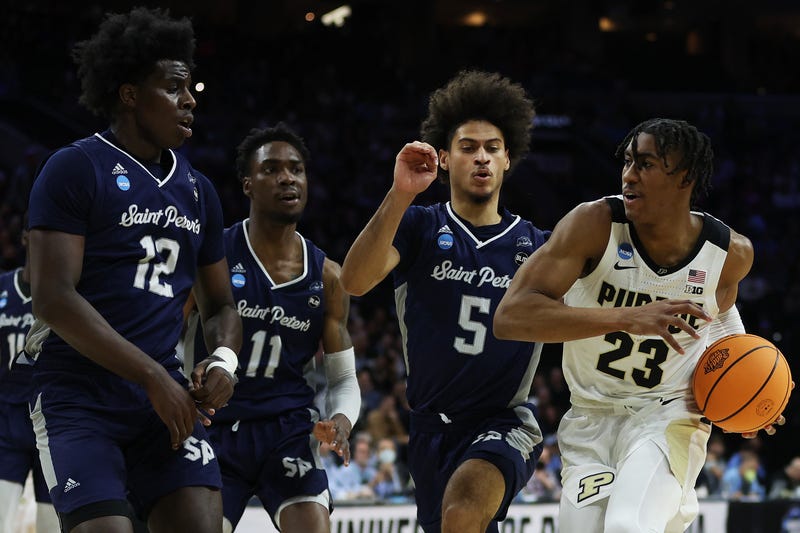 Jaden Ivey #23 of the Purdue Boilermakers protects the ball from Clarence Rupert #12, KC Ndefo #11 and Daryl Banks III #5 of the St. Peter's Peacocks in the first half of the game in the Sweet Sixteen round of the 2022 NCAA Men's Basketball Tournament at Wells Fargo Center on March 25, 2022 in Philadelphia, Pennsylvania. 