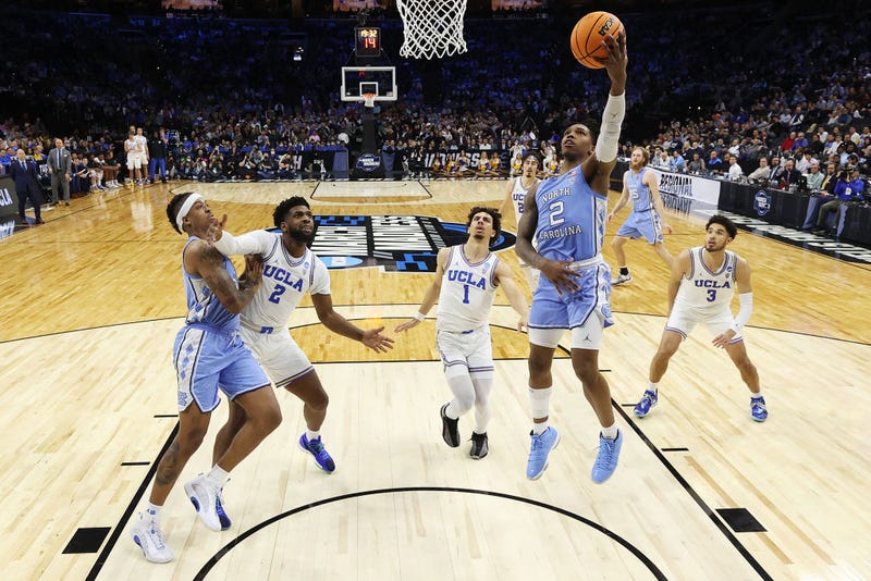 Caleb Love #2 of the North Carolina Tar Heels jumps to dunk the ball in the game against the UCLA Bruins in the Sweet Sixteen round game of the 2022 NCAA Men's Basketball Tournament at Wells Fargo Center on March 25, 2022 in Philadelphia, Pennsylvania.