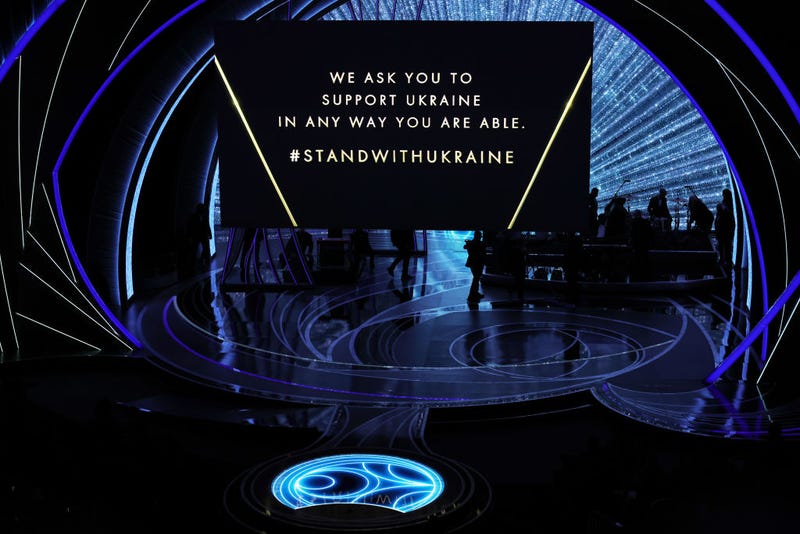 FILE - A call-to-action message regarding the war in Ukraine is projected on a screen during the 94th Annual Academy Awards at Dolby Theatre on March 27, 2022 in Hollywood, CaliF.