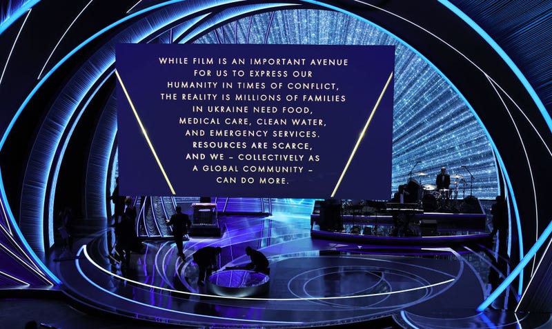 A call-to-action message regarding the war in Ukraine is projected on a screen during the 94th Annual Academy Awards at Dolby Theatre on March 27, 2022 in Hollywood, Calif.