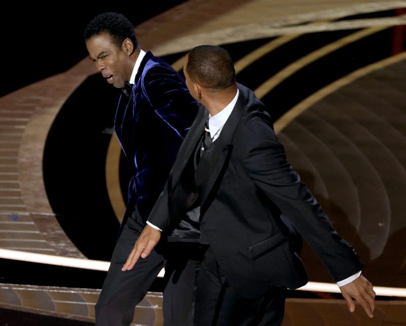 HOLLYWOOD, CALIFORNIA - MARCH 27: Will Smith appears to slap Chris Rock onstage during the 94th Annual Academy Awards at Dolby Theatre on March 27, 2022 in Hollywood, California.
