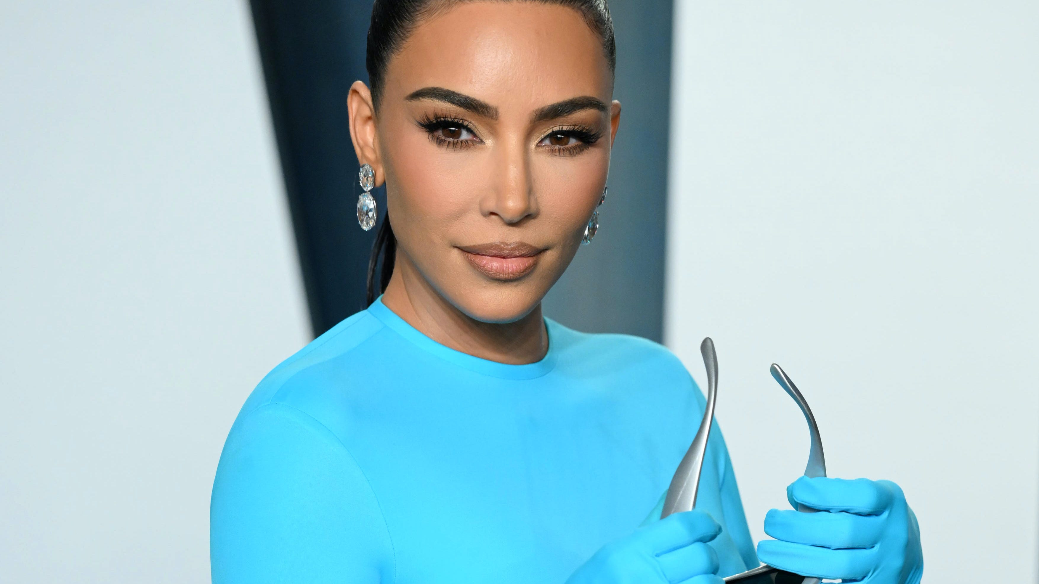 Kim Kardashian displays all her curves in blue body-hugging gown at Oscars after-party