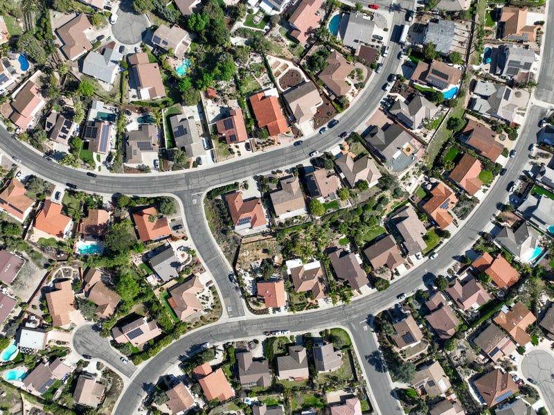 Aerial top view of middle class neighborhood with villas in South California, USA
