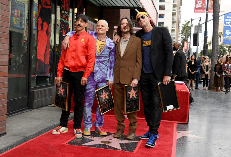 (L-R) Anthony Kiedis, Flea, John Frusciante and Chad Smith of The Red Hot Chili Peppers attend the Hollywood Walk of Fame Star Ceremony for The Red Hot Chili Peppers on March 31, 2022 in Hollywood, California.