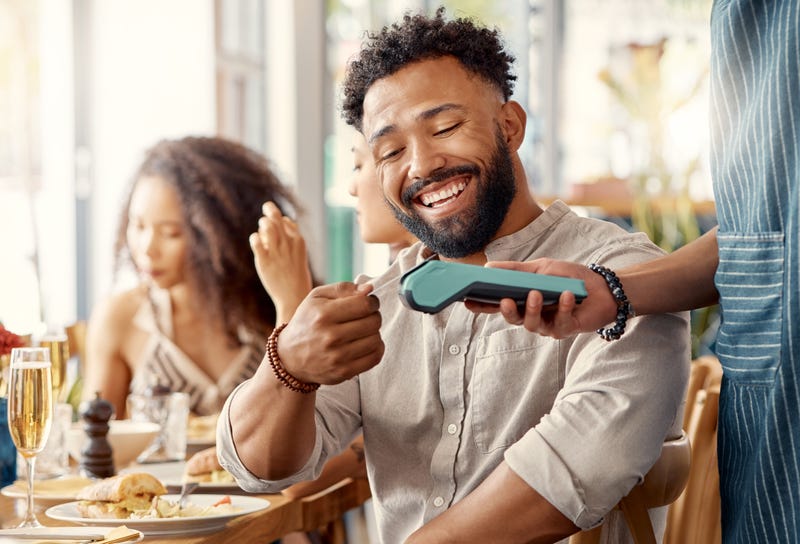 person paying with credit card
